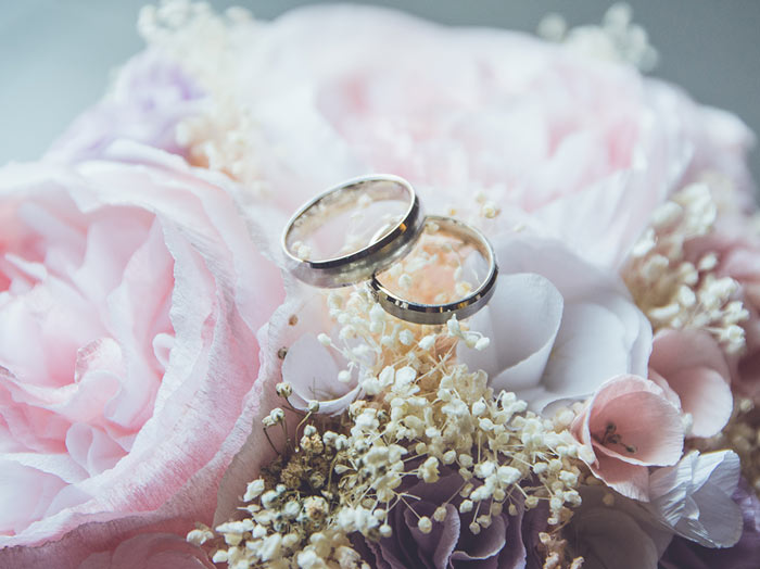 wedding rings on flowers